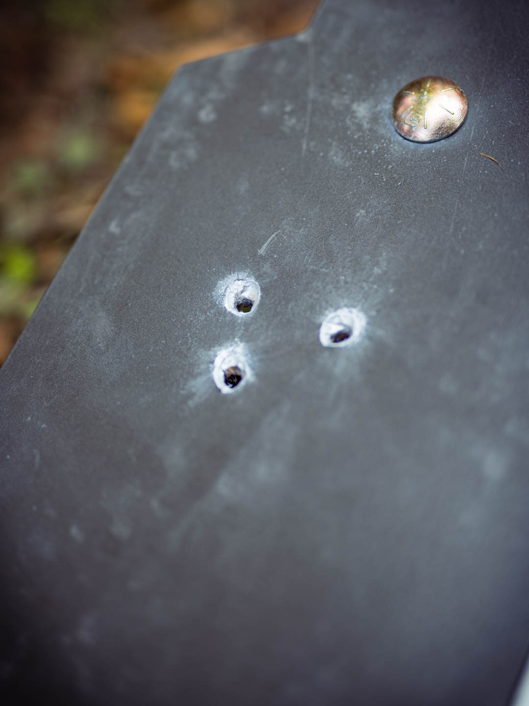 Three bullet holes in the AR500 Plate AR500 VS M61 will create bullet holes in the plate