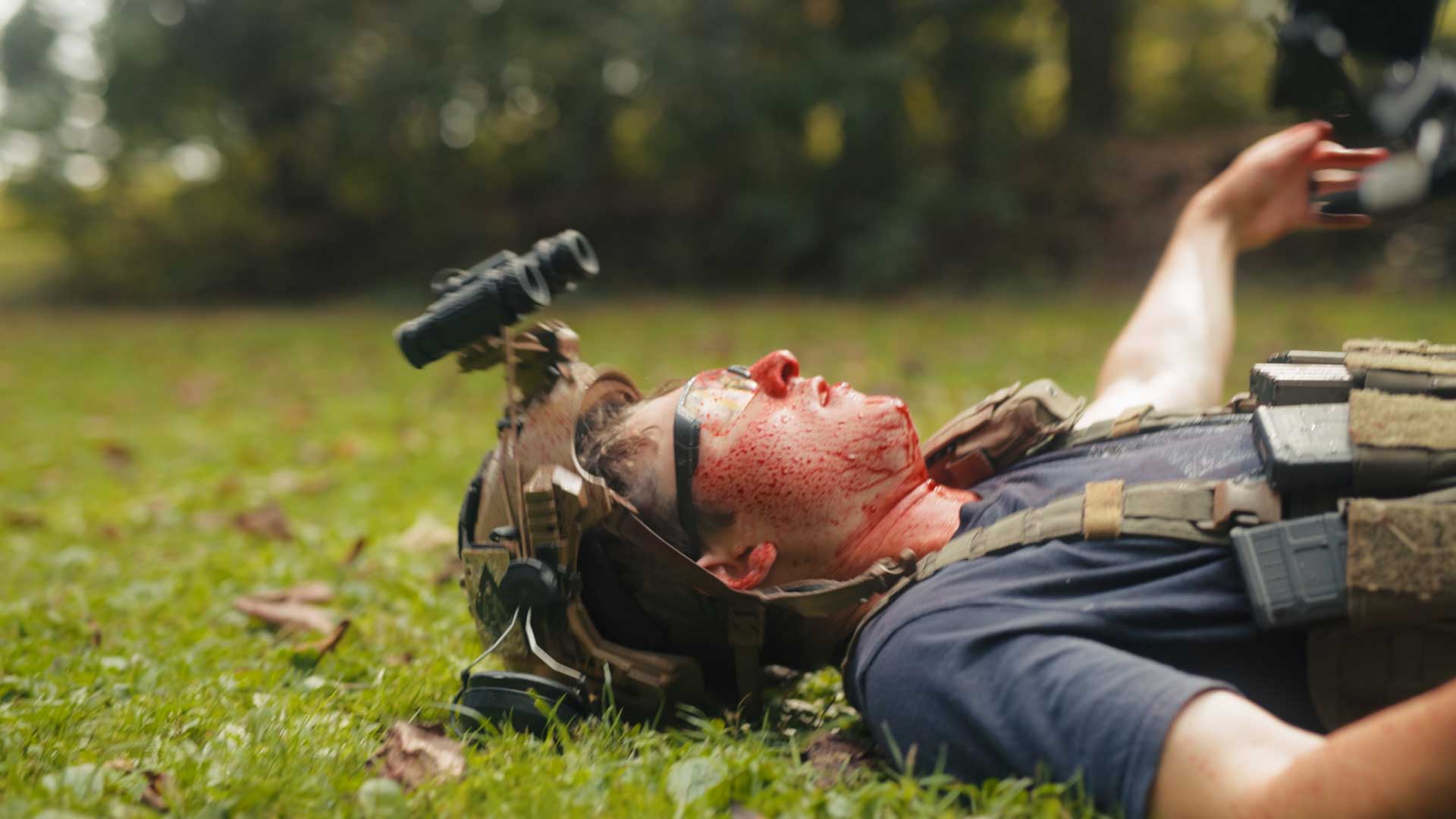 Brenton laying down dead Brenton bleeding while wearing night vision and thermal goggles
