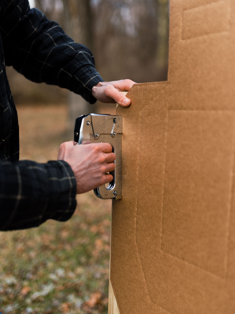 Stapling the Cardboard Target to the Mounting Sticks