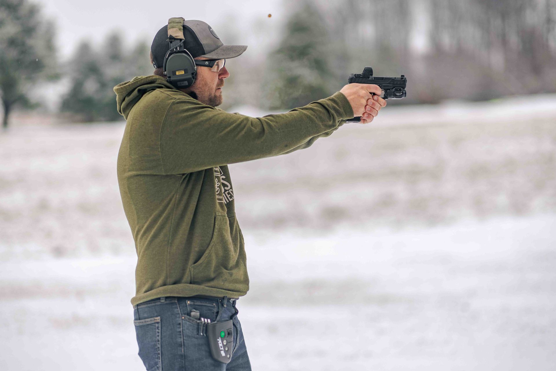 Jared firing his pistol during the Delorean Drill