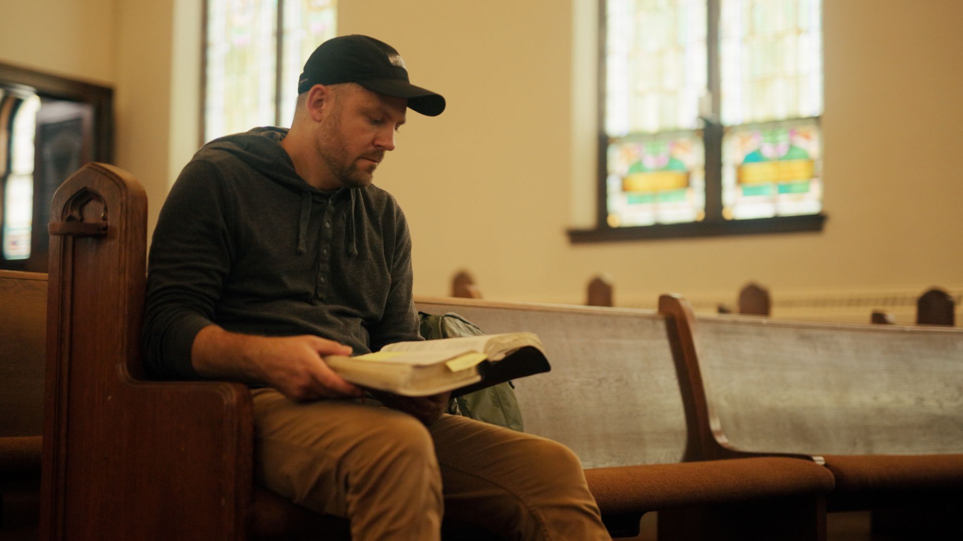 Sitting in a pew reading the Bible