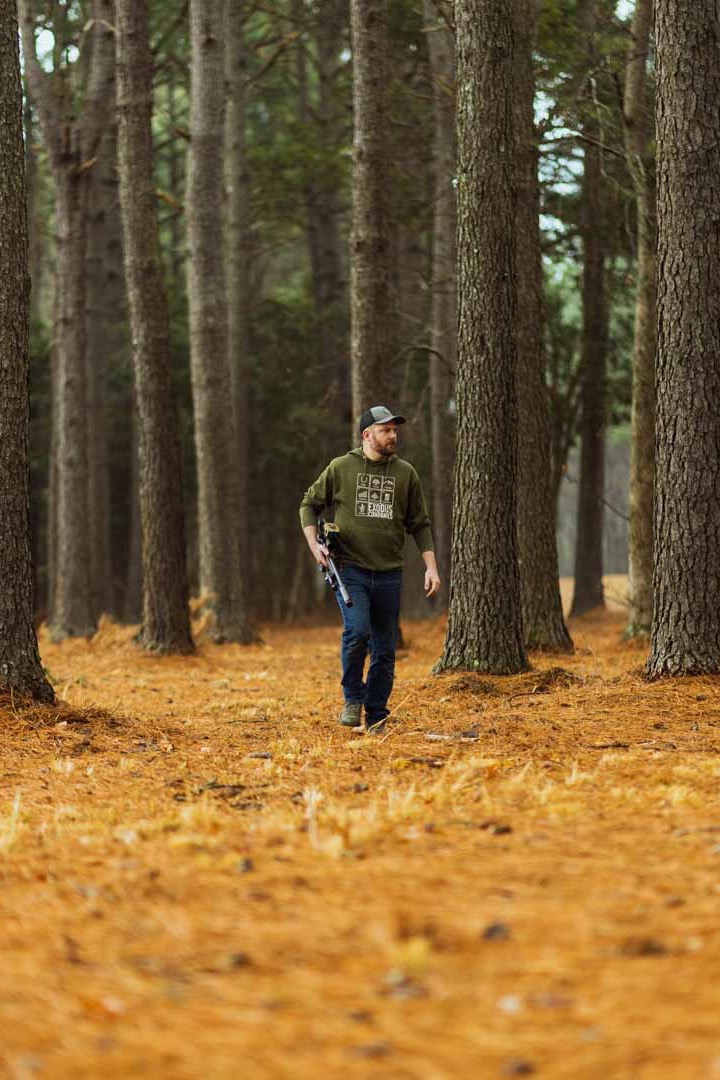 Walking through the woods with a tactical lever action rifle