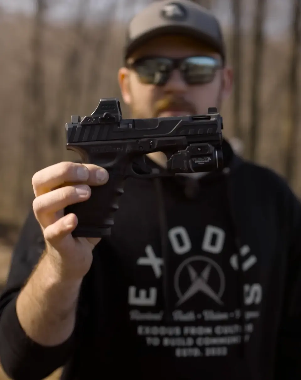 Jared holding out his EDC Glock 19