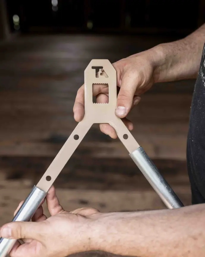 Placing two conduit on the bracket of the gong stand legs Placing two conduit on the bracket of the gong stand legs