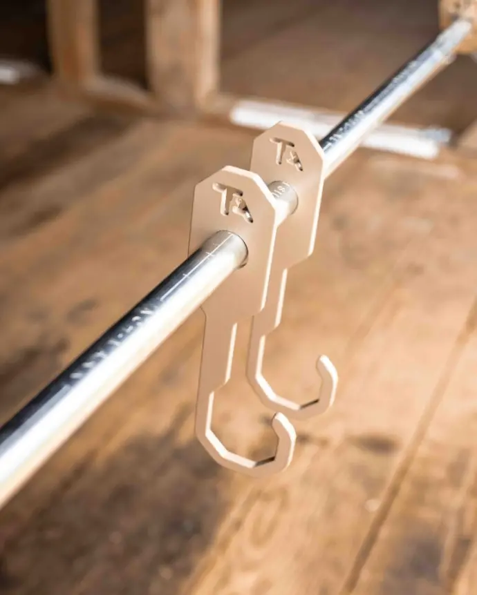 Standard hooks resting on a conduit pipe Standard hooks resting on a conduit pipe
