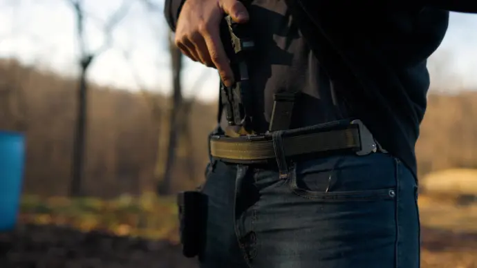 Pulling a gun from the holster Pulling a gun from the holster