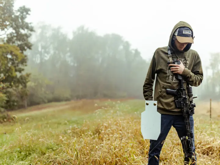Young Man holding a TA Target