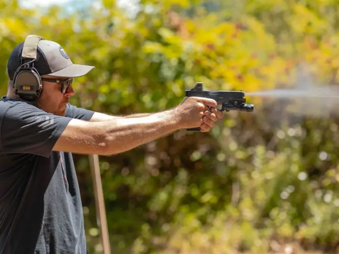 Jared firing a Glock at the range Jared firing a Glock at the range