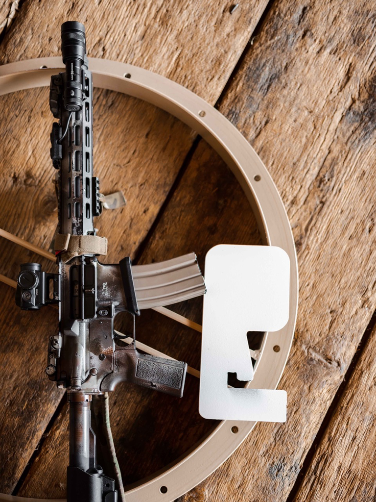 AR15-laying-down-with-Dueling-Tree.webp